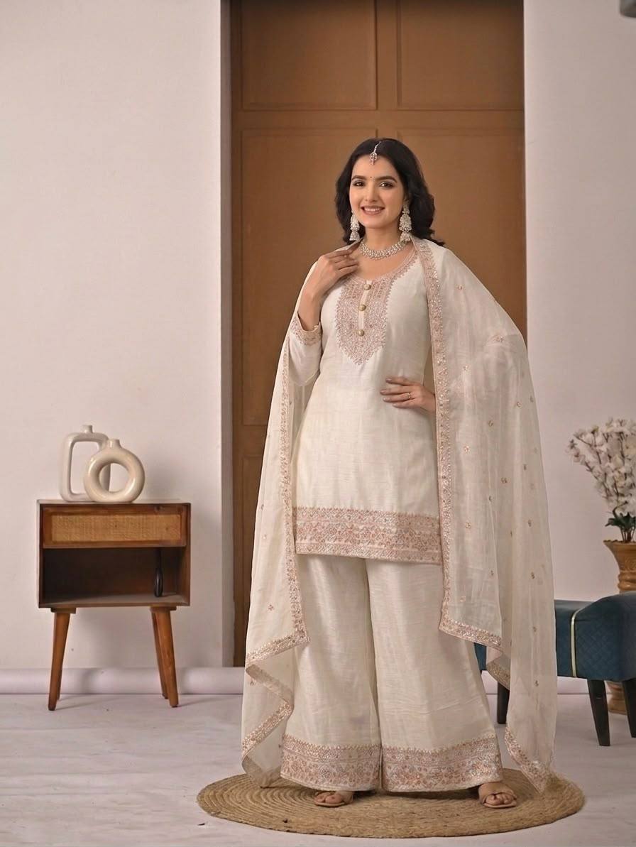 Pristine Ivory White Kurta and Palazzo Set Featuring Delicate Floral Embroidery, Sequined Borders, and a Matching Sheer Dupatta